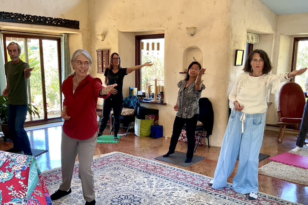 Martha leading a qigong class to a group of students