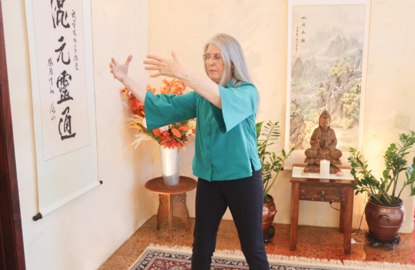 Martha leading a qigong exercise online