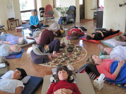 Martha leading a restorative qigong exercise